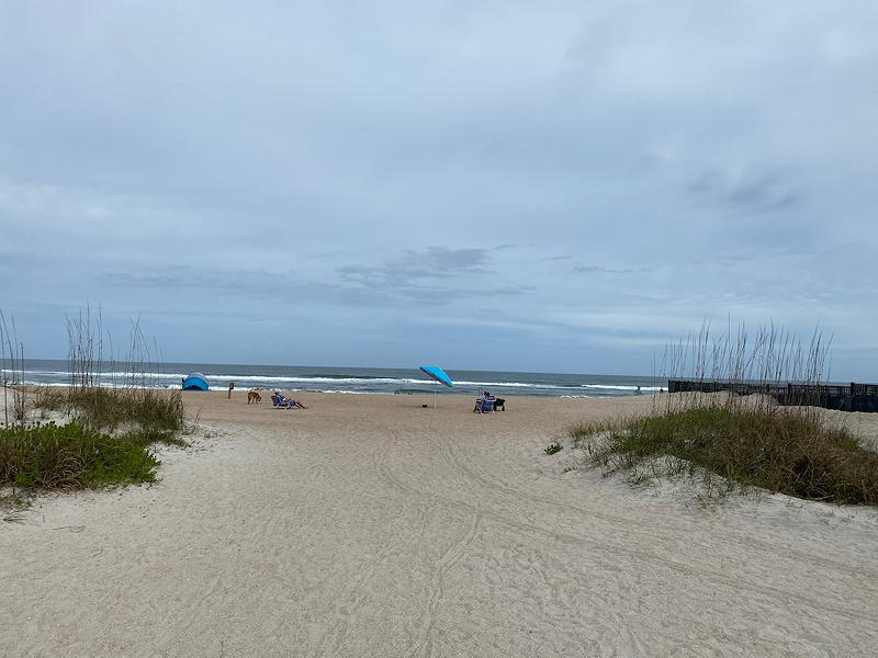 When you arrive by foot via Pope Road, you cross through a small parking lot to see this sandy entrance to the beach.