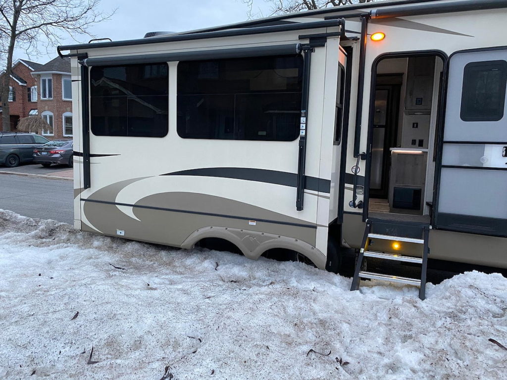 We have to open the slide-outs to get access to the back of the trailer, the kitchen cupboard, and the bedroom closet.