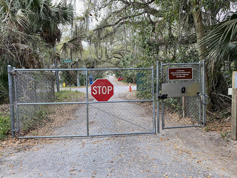 As it turns out, the road was effectively a dead end. There's a gate that can be opened by a buzzer but it wasn't working. Joanne didn't want to climb the fence so we went back the way we came.